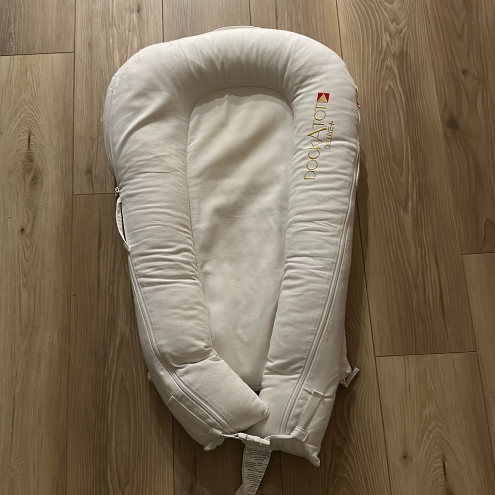 DockATot white co-sleeper infant